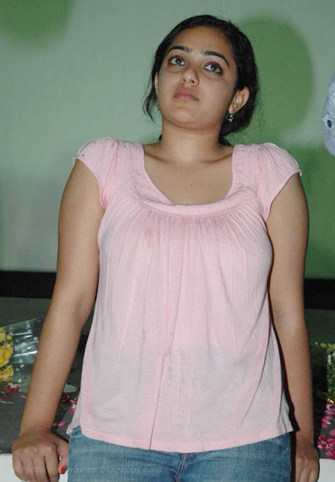 nithya menon in pink sleeve less top actress pics